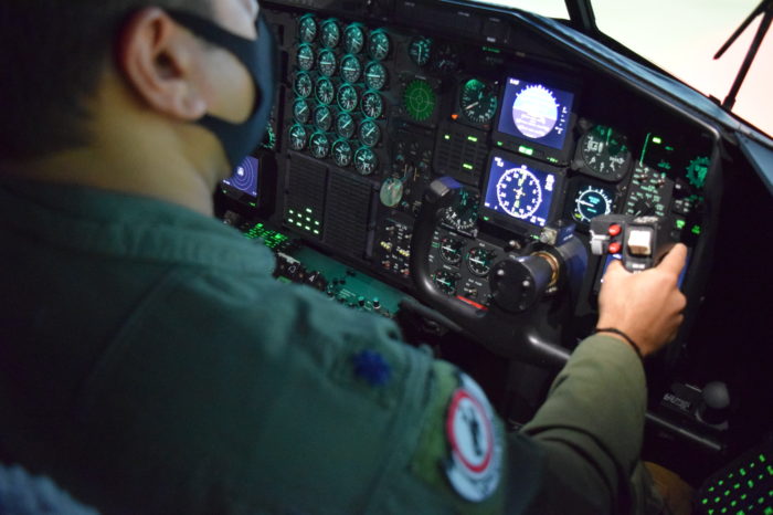 Chamber Members Take a Simulated Flight in C-130