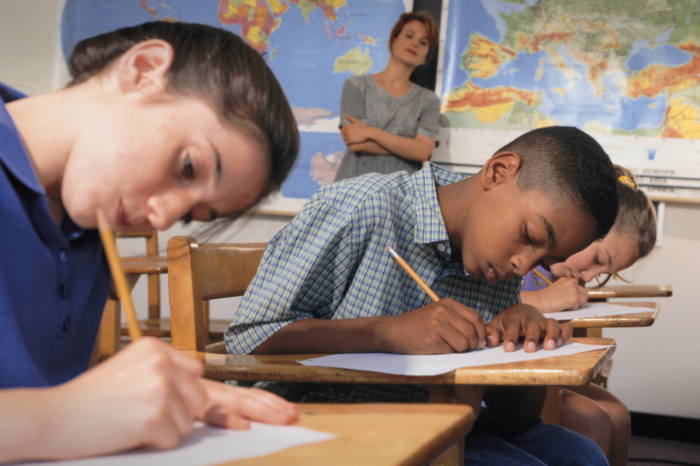 Students take a test in class.