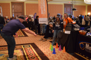 People playing ring toss at a previous Business to Business Expo.