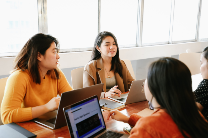 Three women working in a group.