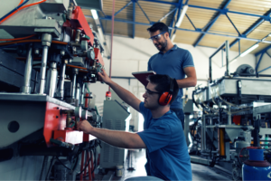 Two workers in a manufacturing facility.