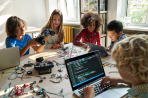 Children using a computer for robotics.