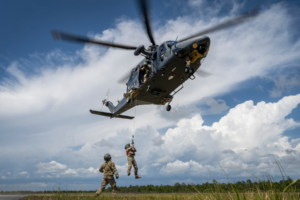 Military personnel at F.E. Warren flying a helicopter.