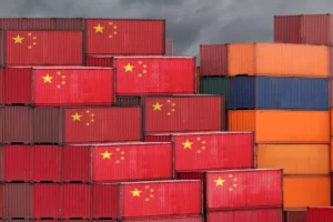 Shipping crates with Chinese flag on the exterior.