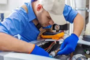 Man working on engine.