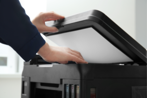 Person scanning a document.