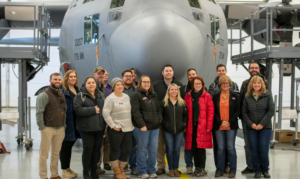 Leadership Cheyenne class in front of a plane.