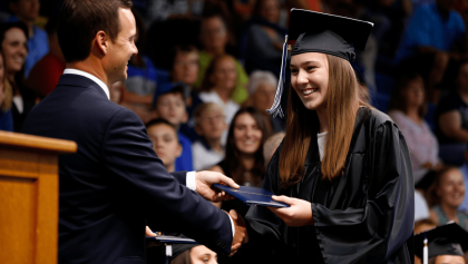 (PHOTOS) Triumph High students walk the stage with loved ones in grad ceremony