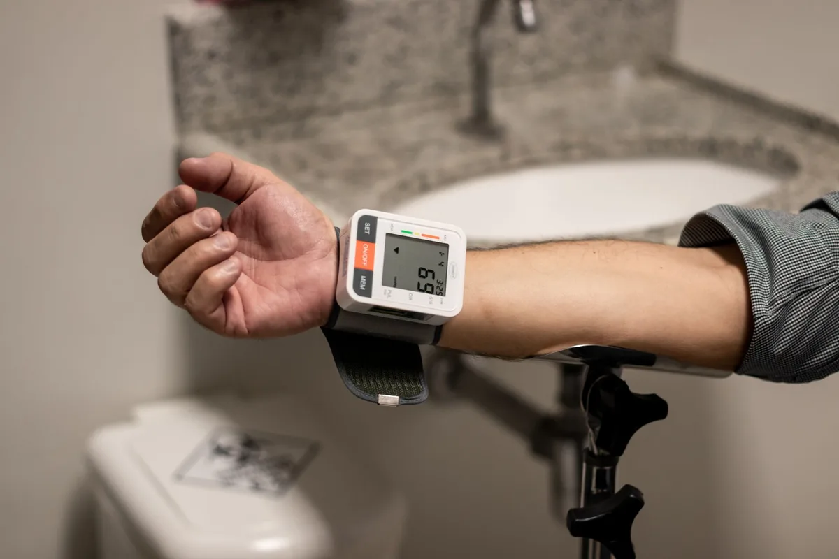 Doctor reviewing health measurements and charts at a clinical desk