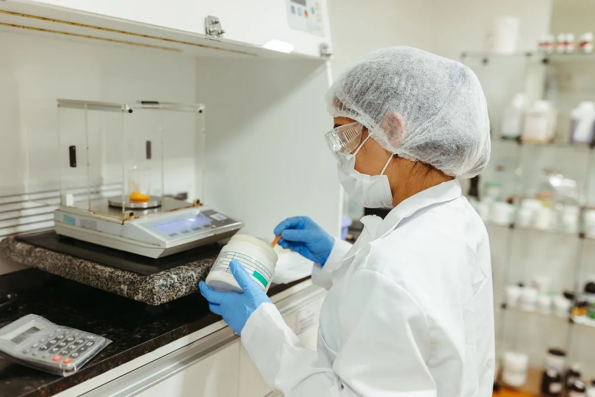 Scientific research workspace with test tubes and data related to sweetener safety studies