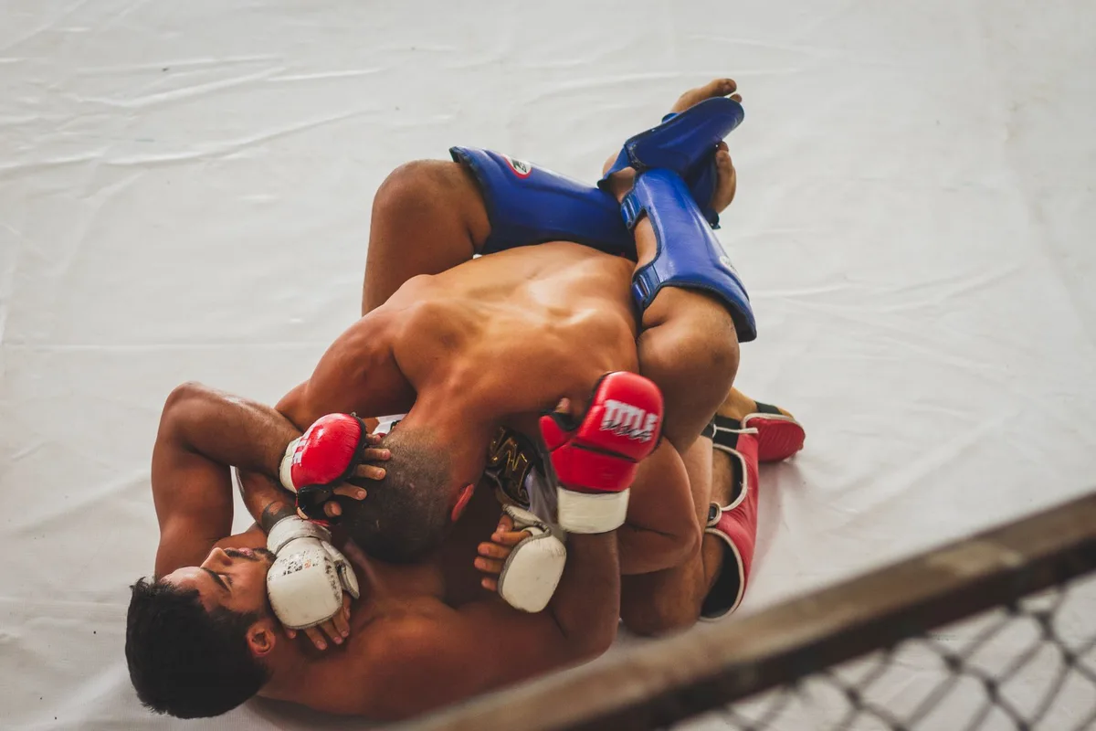 MMA fighter executing aggressive striking combinations in the octagon