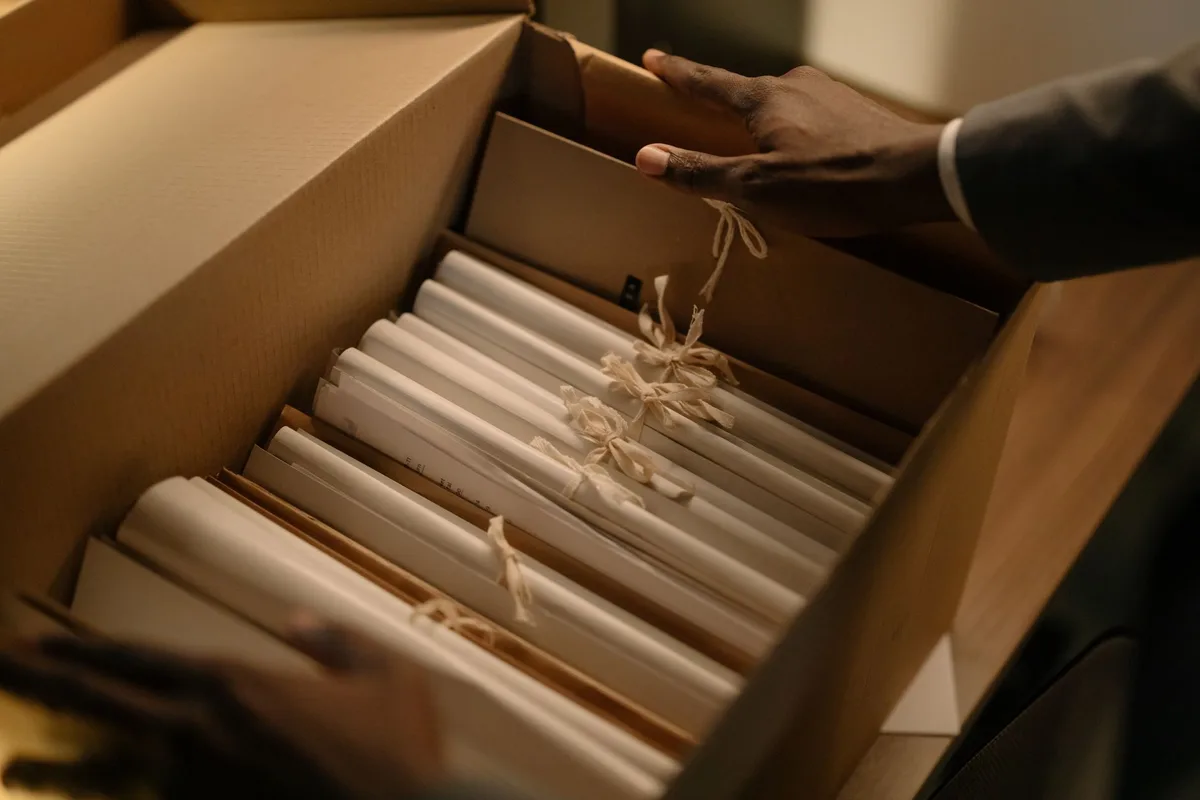 Stacked legal documents and court filing papers on a desk with a gavel