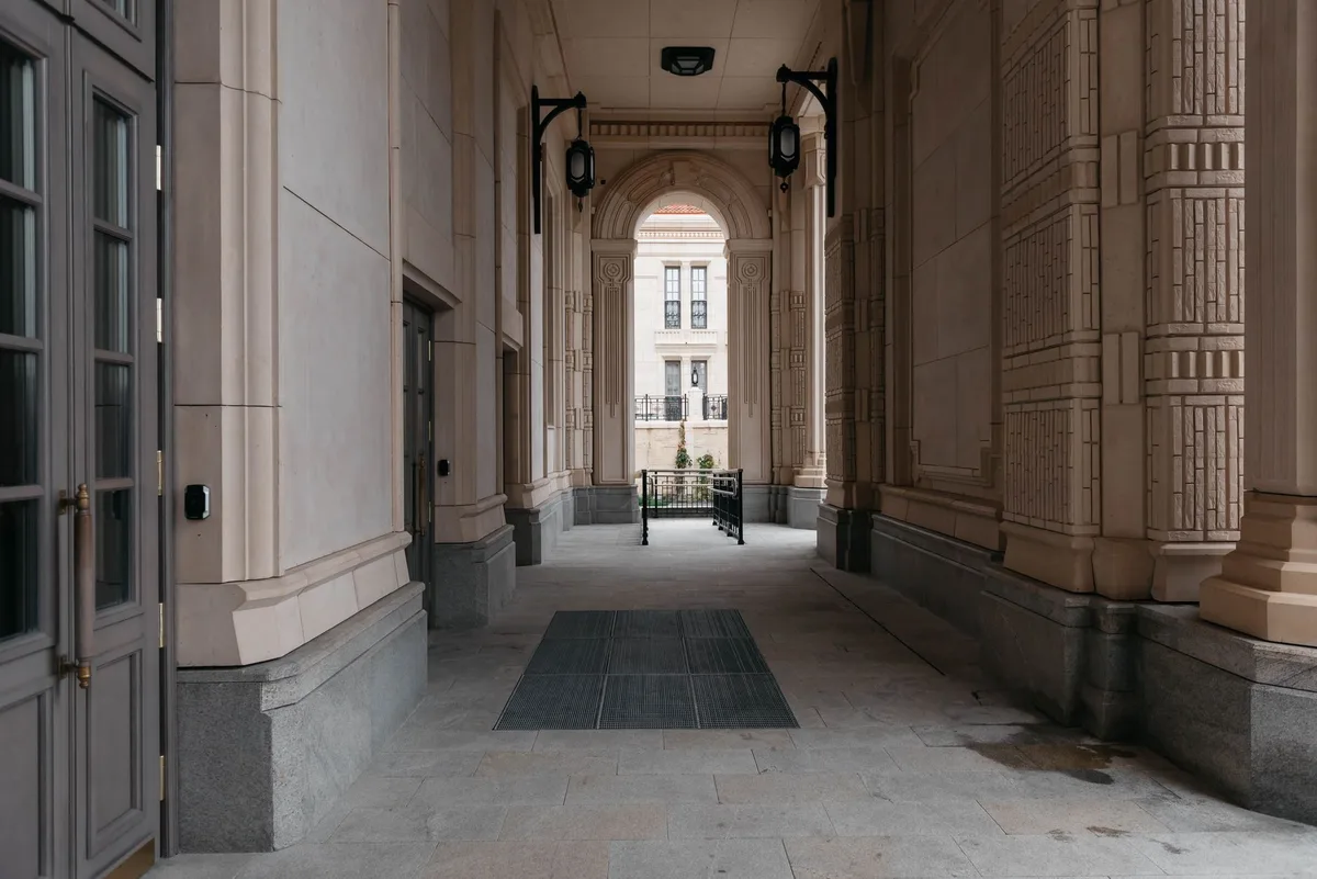 Federal courthouse interior with marble columns and official seals, symbolic of legal proceedings