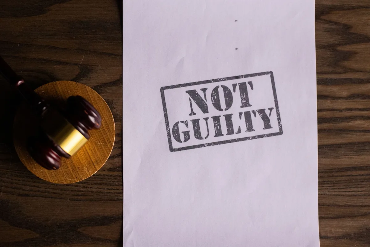Gavel and legal documents representing felony charges and property damage prosecution