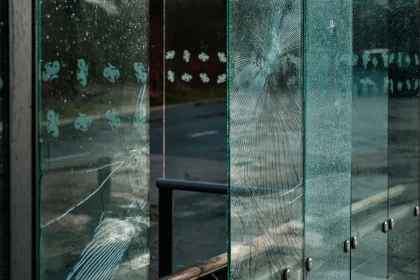 Vandalized car with scratches and damage in a parking lot