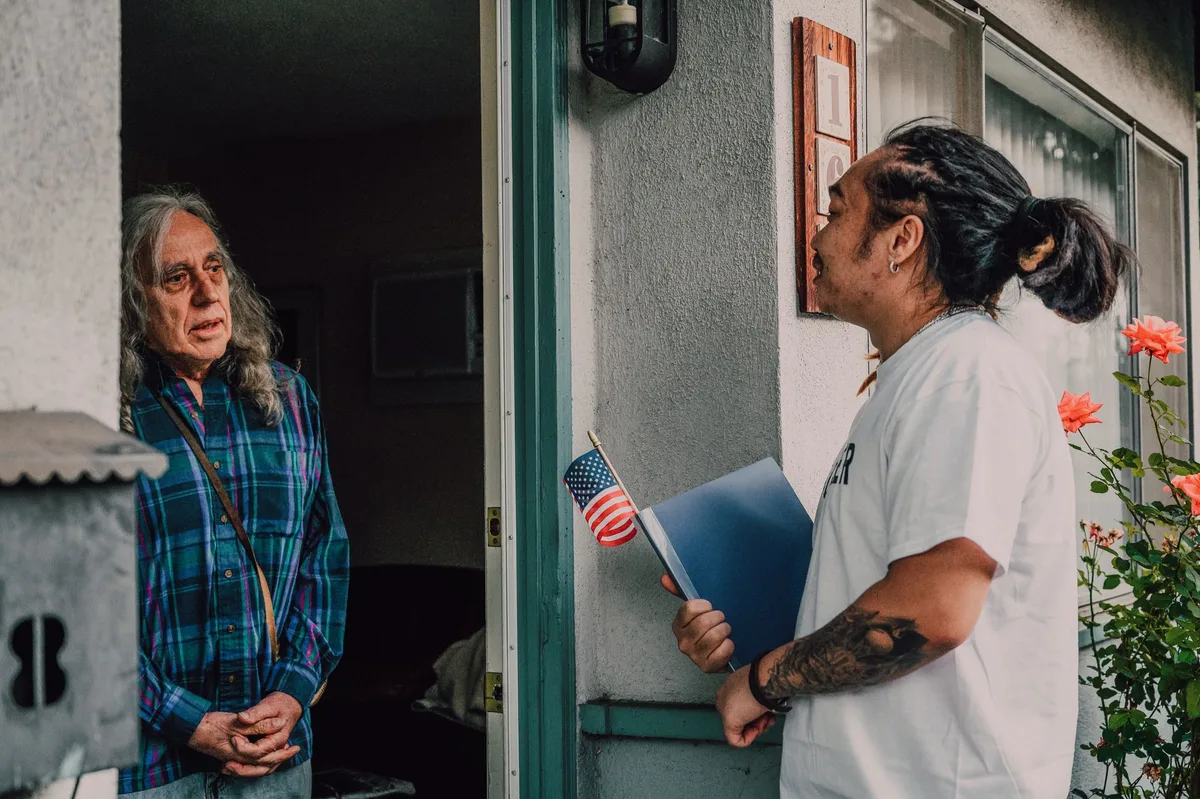 Campaign volunteers conducting voter outreach in a residential neighborhood