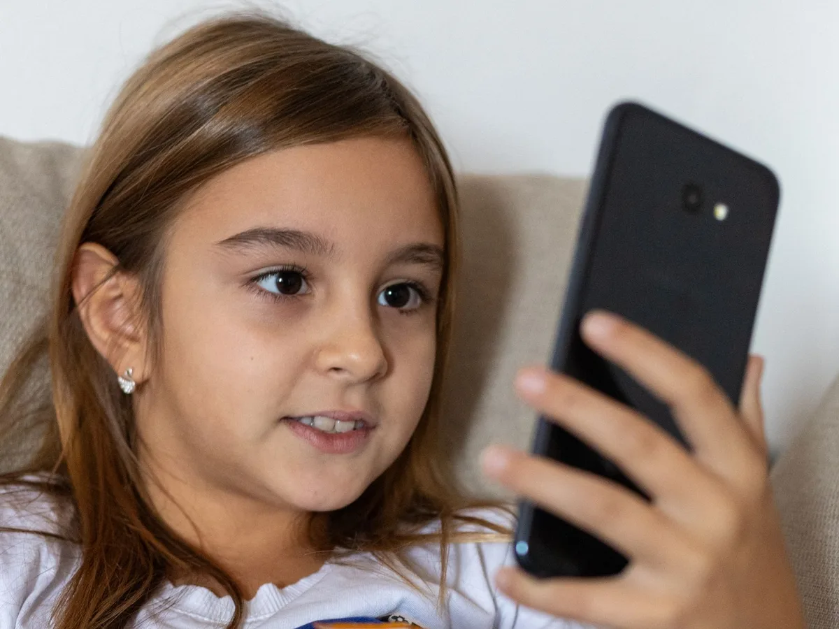 Smartphone showing time limit notification and parental control settings interface