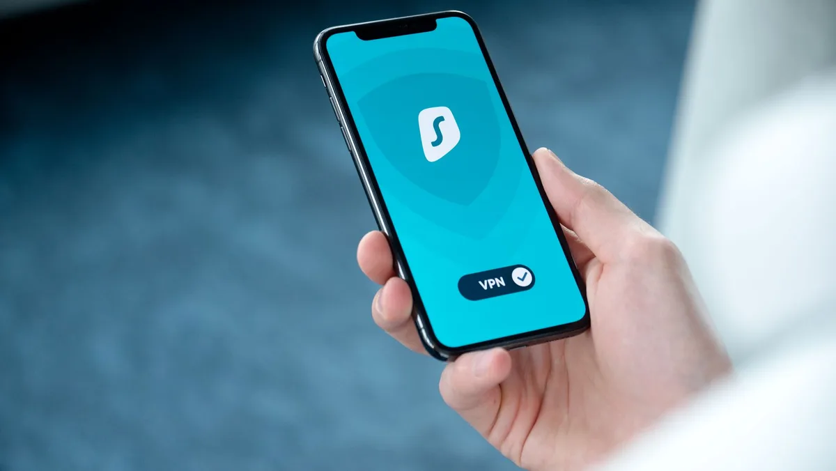 Person adjusting privacy settings on smartphone screen