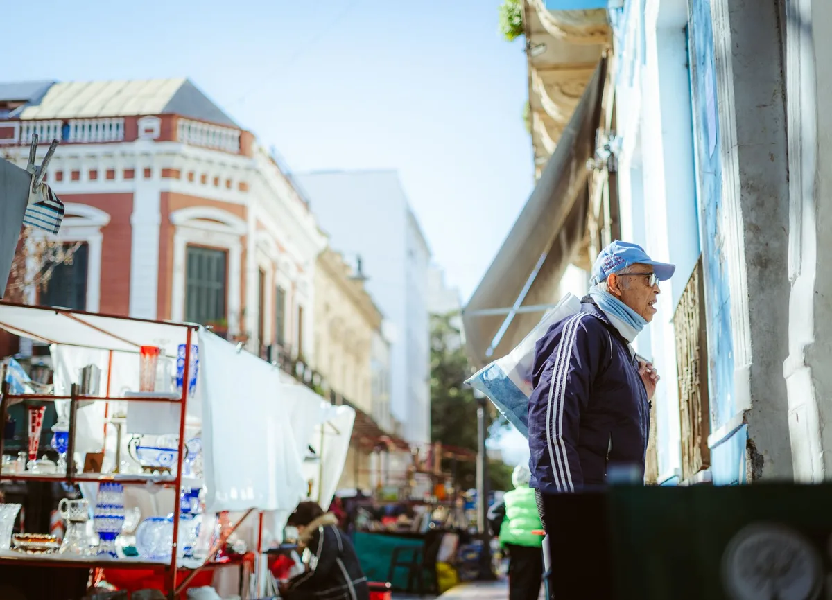 Street vendors and small business owners selling goods at a market or gathering