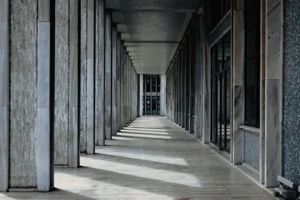Marble corridor in a federal building with institutional architecture and closed doors