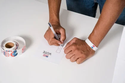 Ballot papers and voting materials on a desk with legislative documents