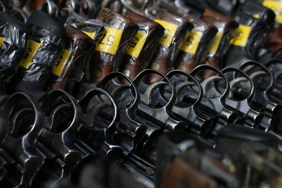 Confiscated firearms, ammunition magazines and tactical equipment displayed during federal investigation