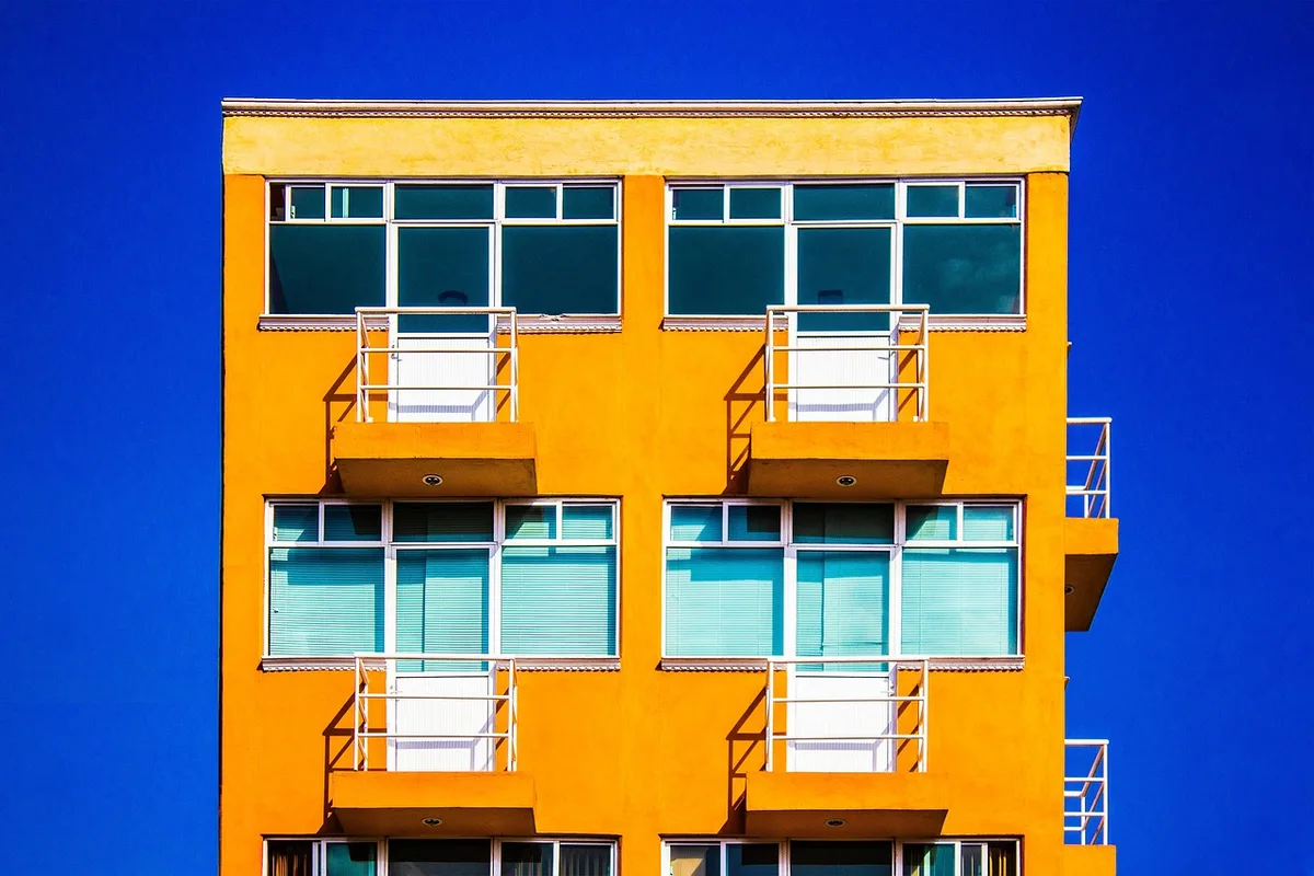 Urban housing shortage with limited affordable apartment units visible