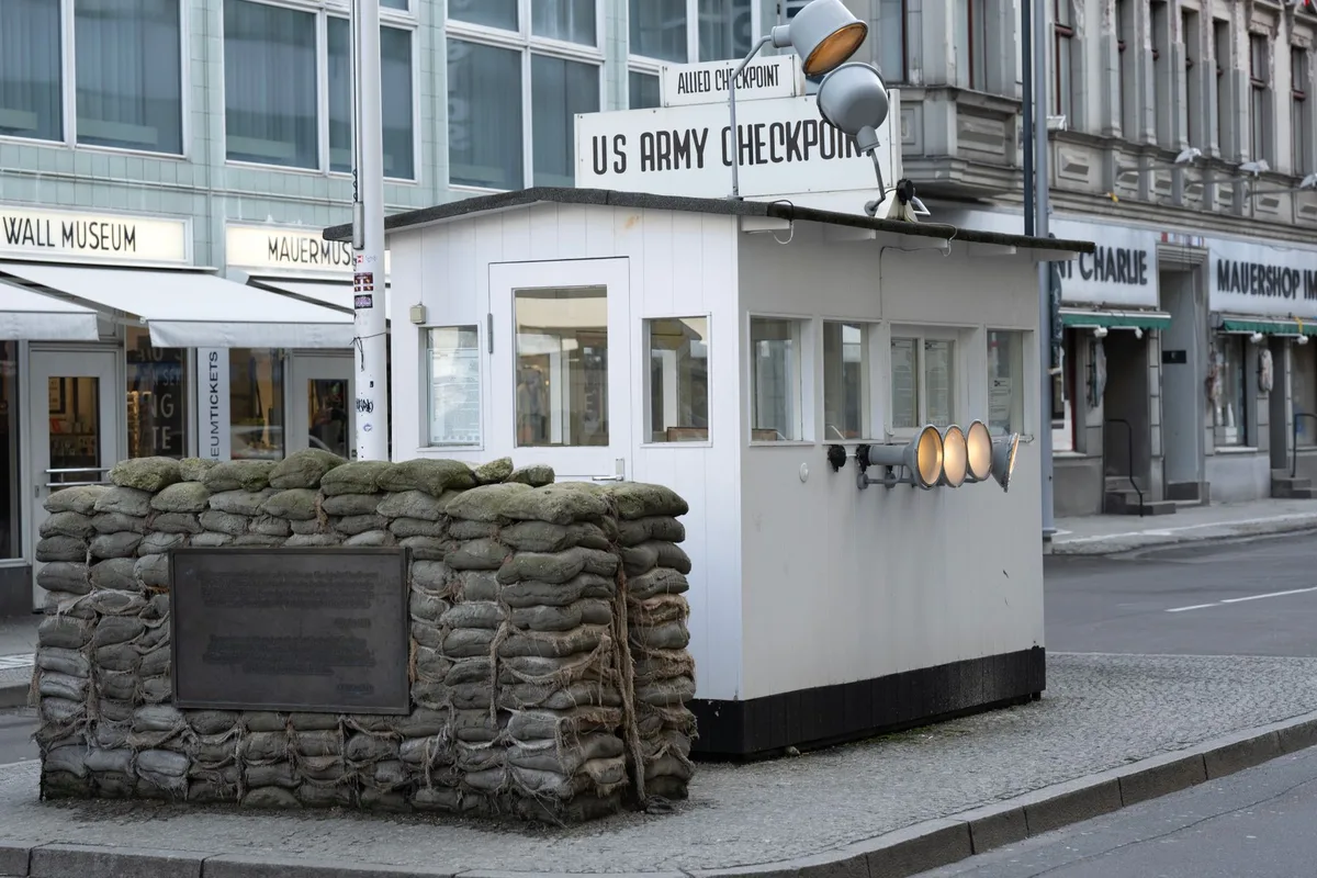 Security personnel conducting access verification and compliance checks at military facility gate