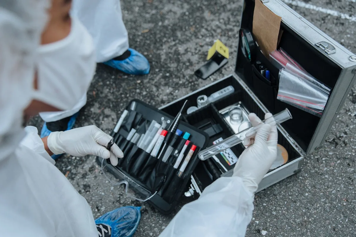 Forensic analyst examining digital evidence and metadata from a smartphone