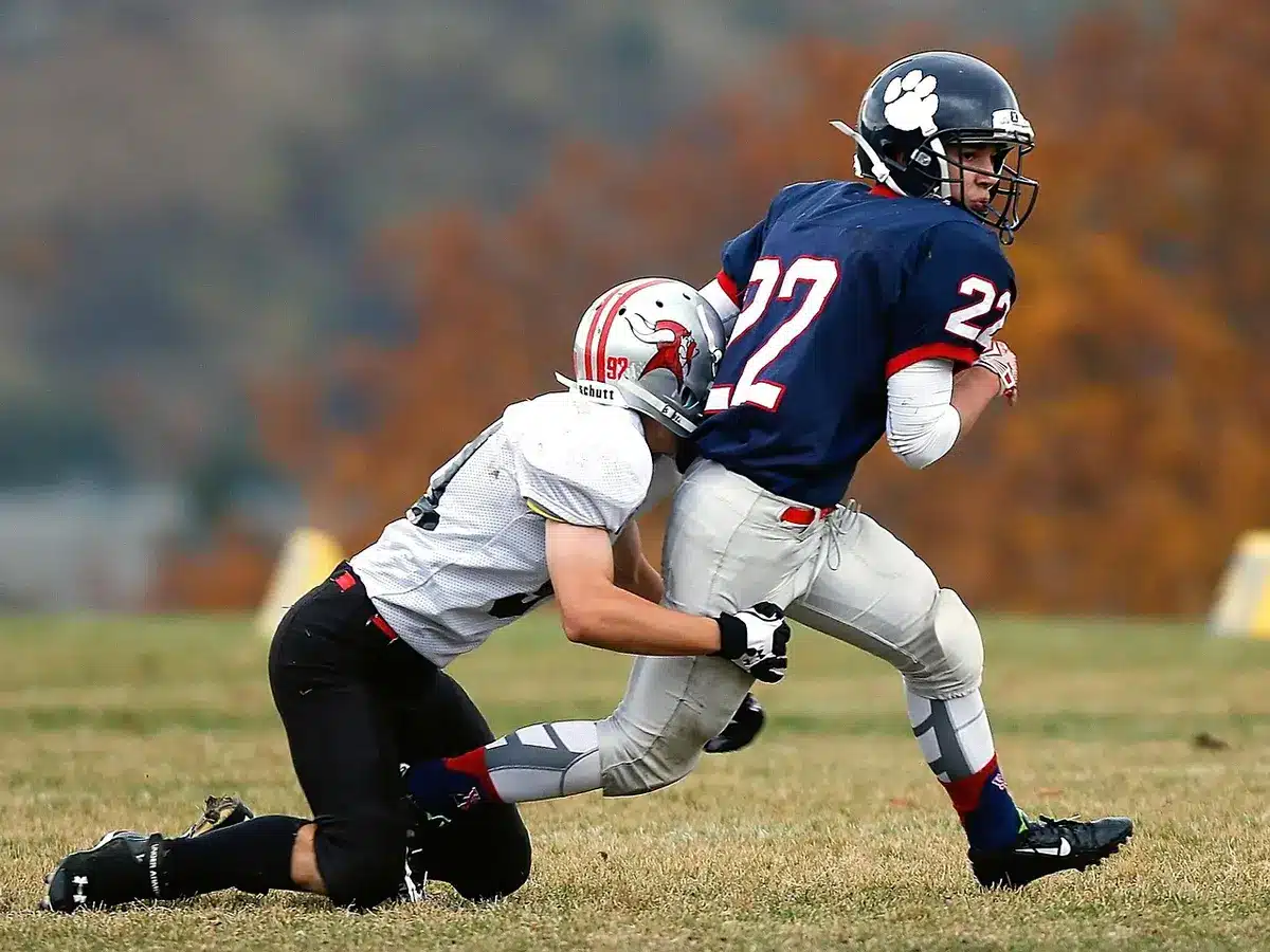 Offensive linemen in blocking drill showing contact and footwork