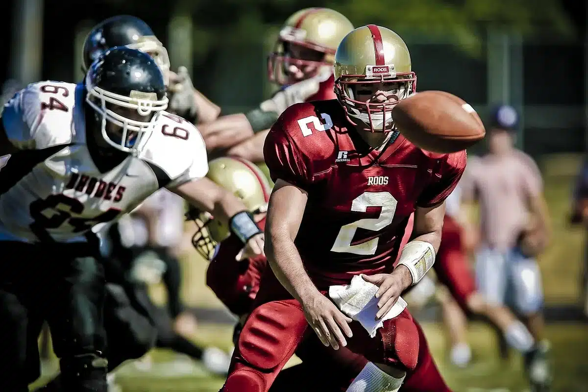 Quarterback warming up on the field before a college game