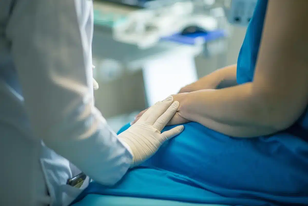 Clinician and patient in discussion during medical consultation appointment