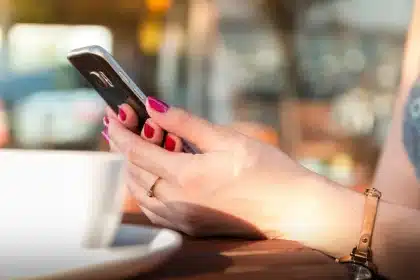 Voter registration mail and smartphone on a kitchen table with generic government form
