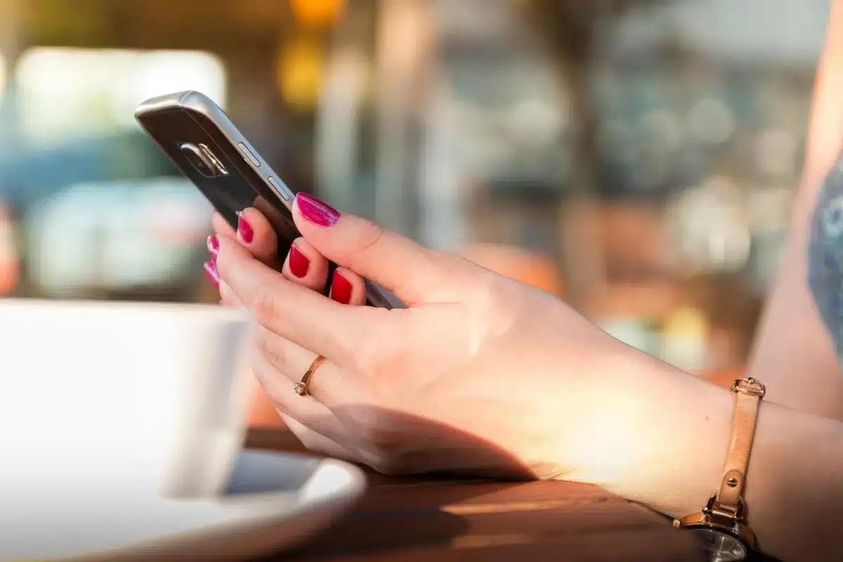 Voter registration mail and smartphone on a kitchen table with generic government form
