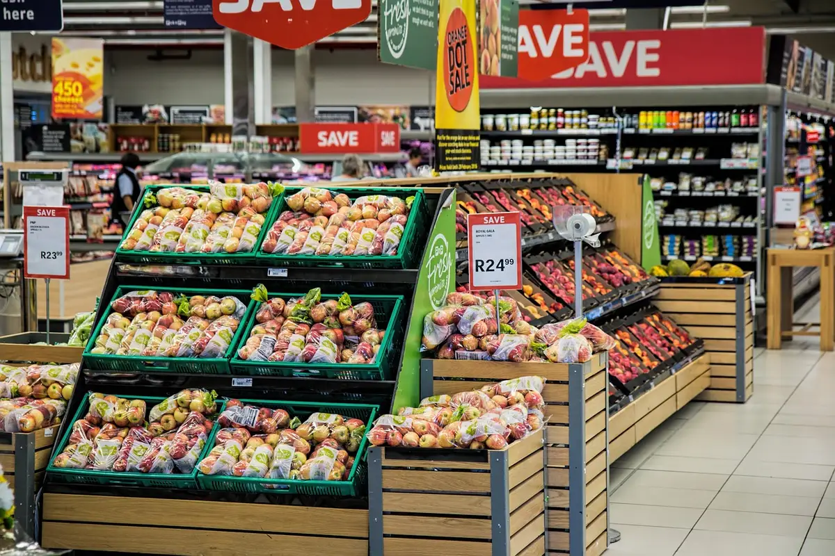 International supermarket aisle with colorful jars of spices, pastes, and condiments on shelves
