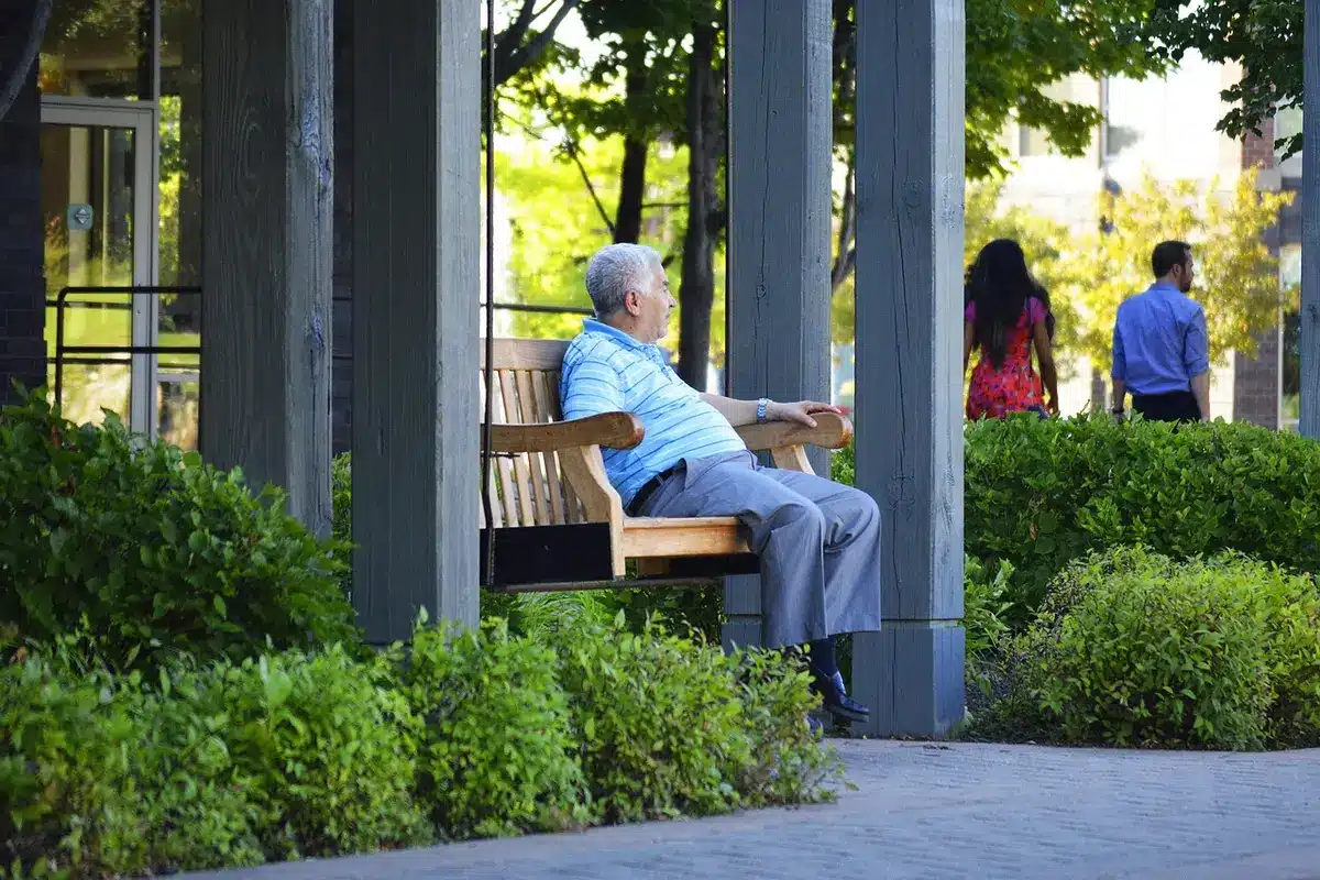 Veteran player sitting on the bench watching teammates during a game