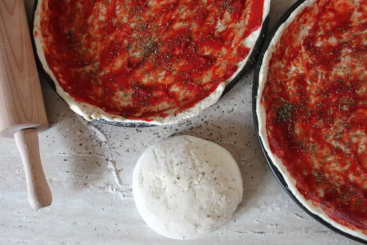 Close-up of tomato sauce and pizza toppings illustrating nutrients in sauce