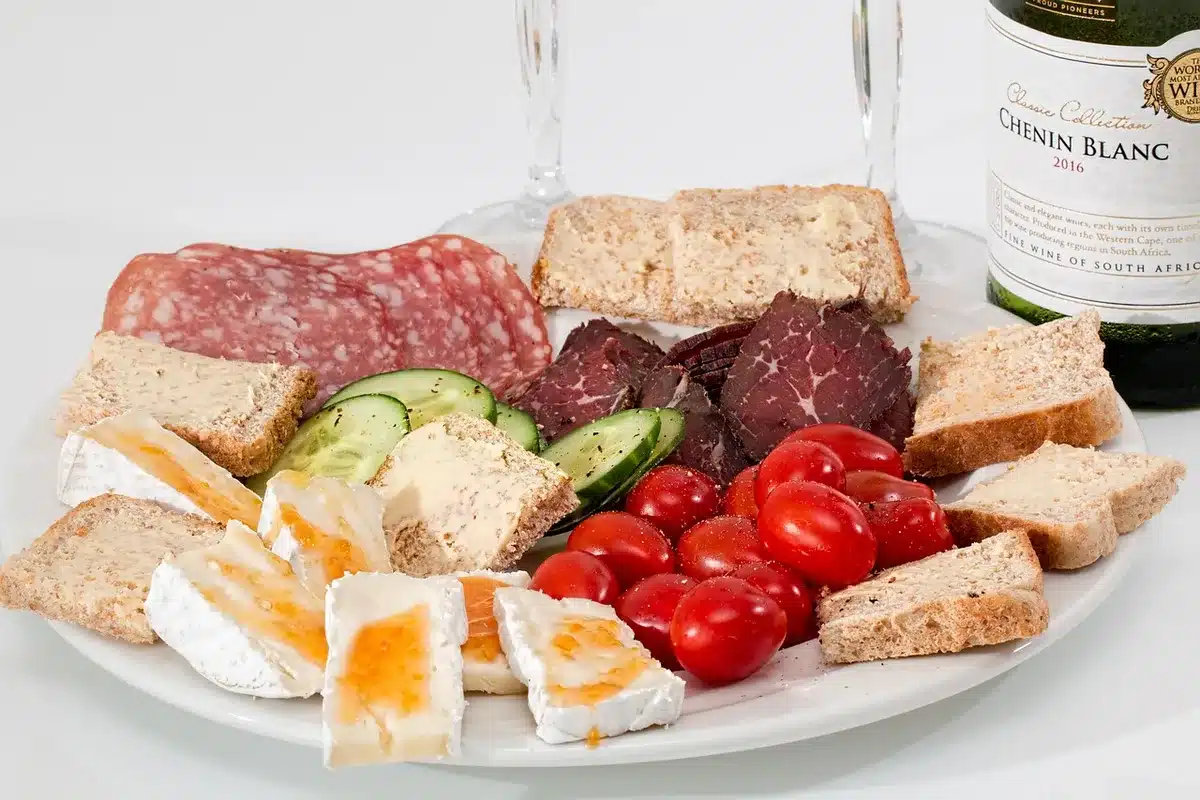 Assortment of processed meats such as bacon, ham and salami on a platter