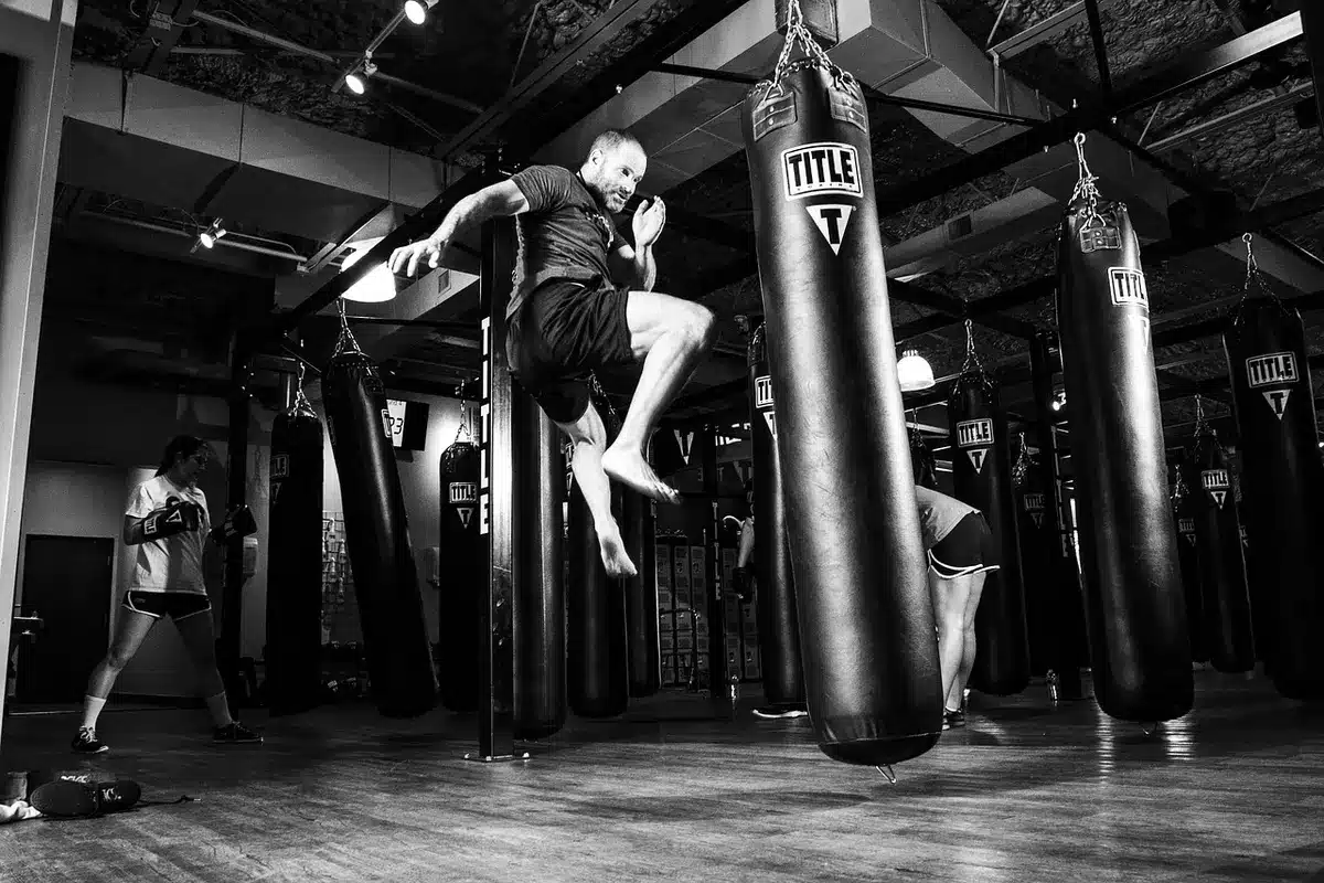Training gloves and mitts in a gym symbolizing a fighter's preparation