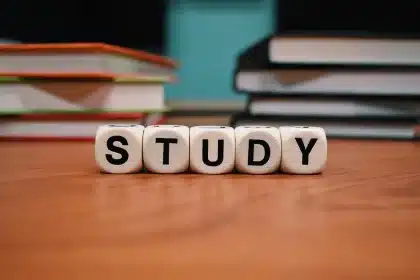 Church classroom table with children's Bible storybooks and a pair of sneakers