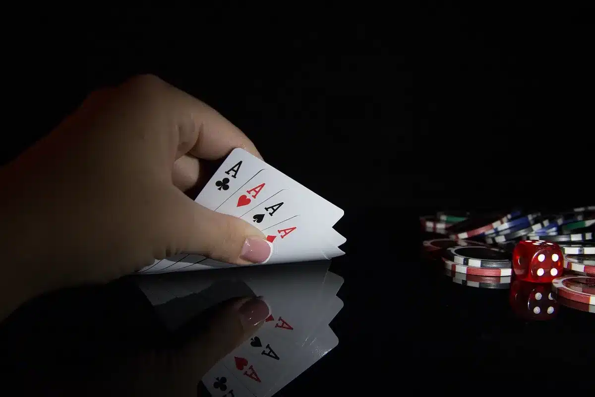 Close-up of poker chips and a handwritten note representing a staking dispute