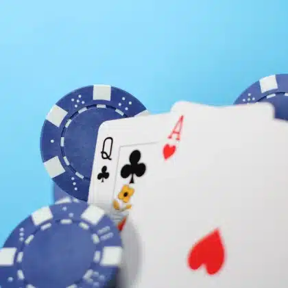 Anonymous casino table with chips, cash and a handwritten note on felt