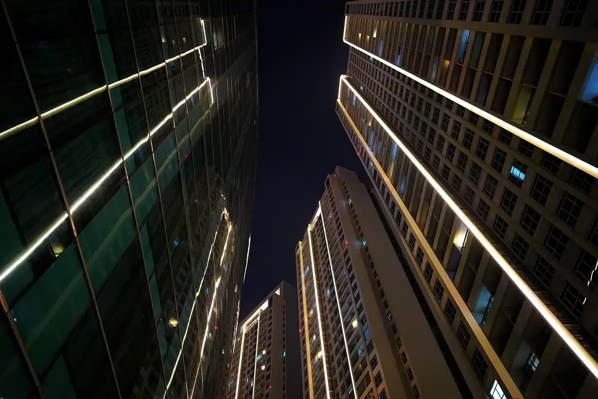 Police lights outside an apartment building entrance at night