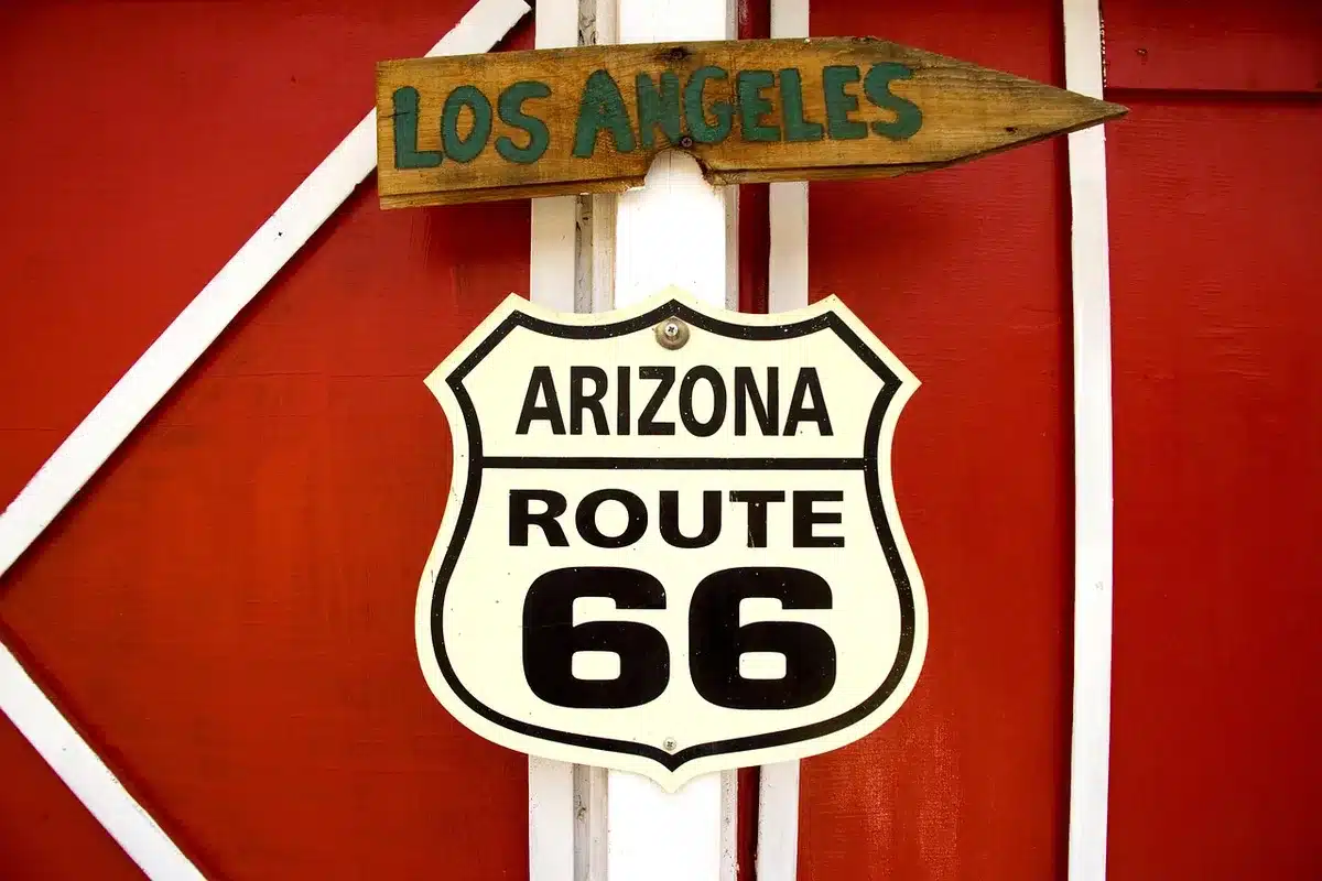 Digital roadside sign showing gasoline prices near a highway