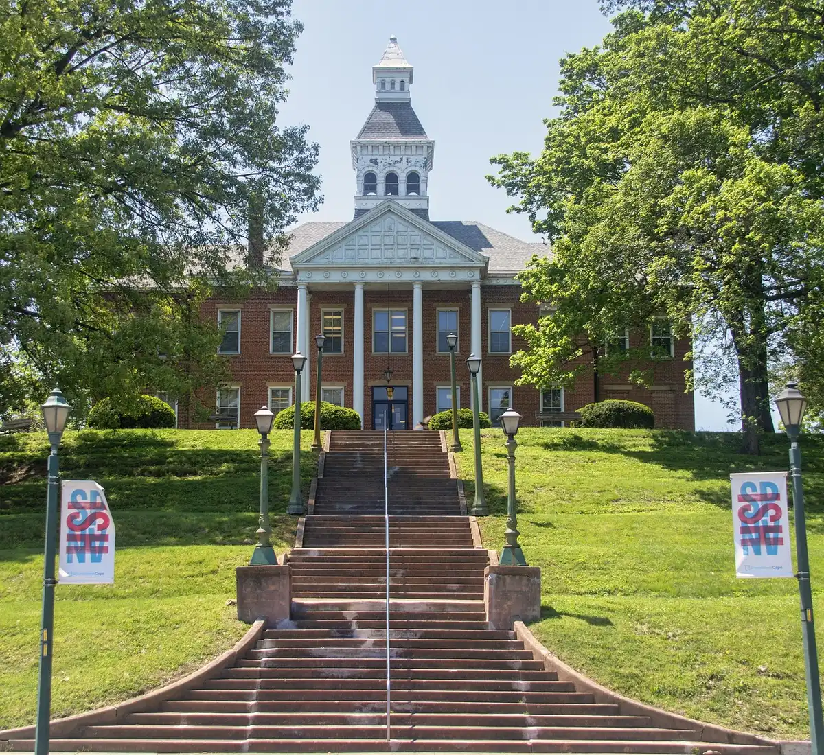 Exterior steps of a courthouse under a clear sky