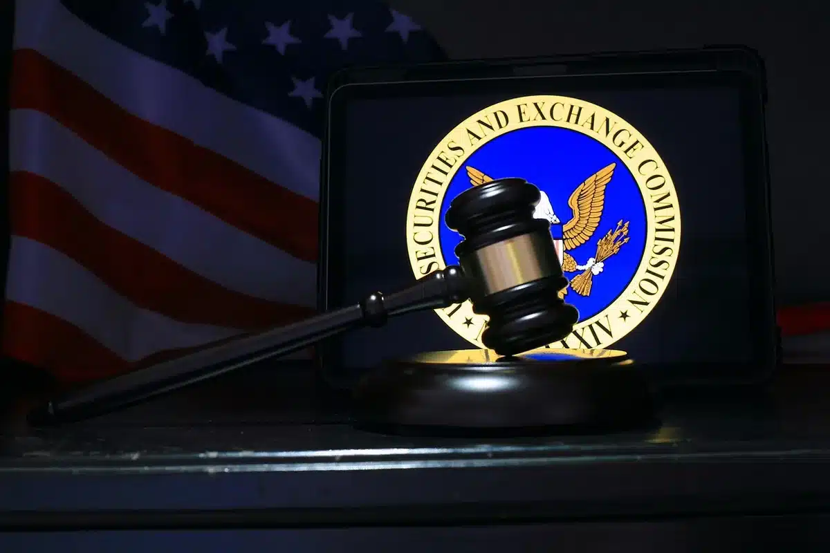 Gavel and court files on a desk representing charges and plea
