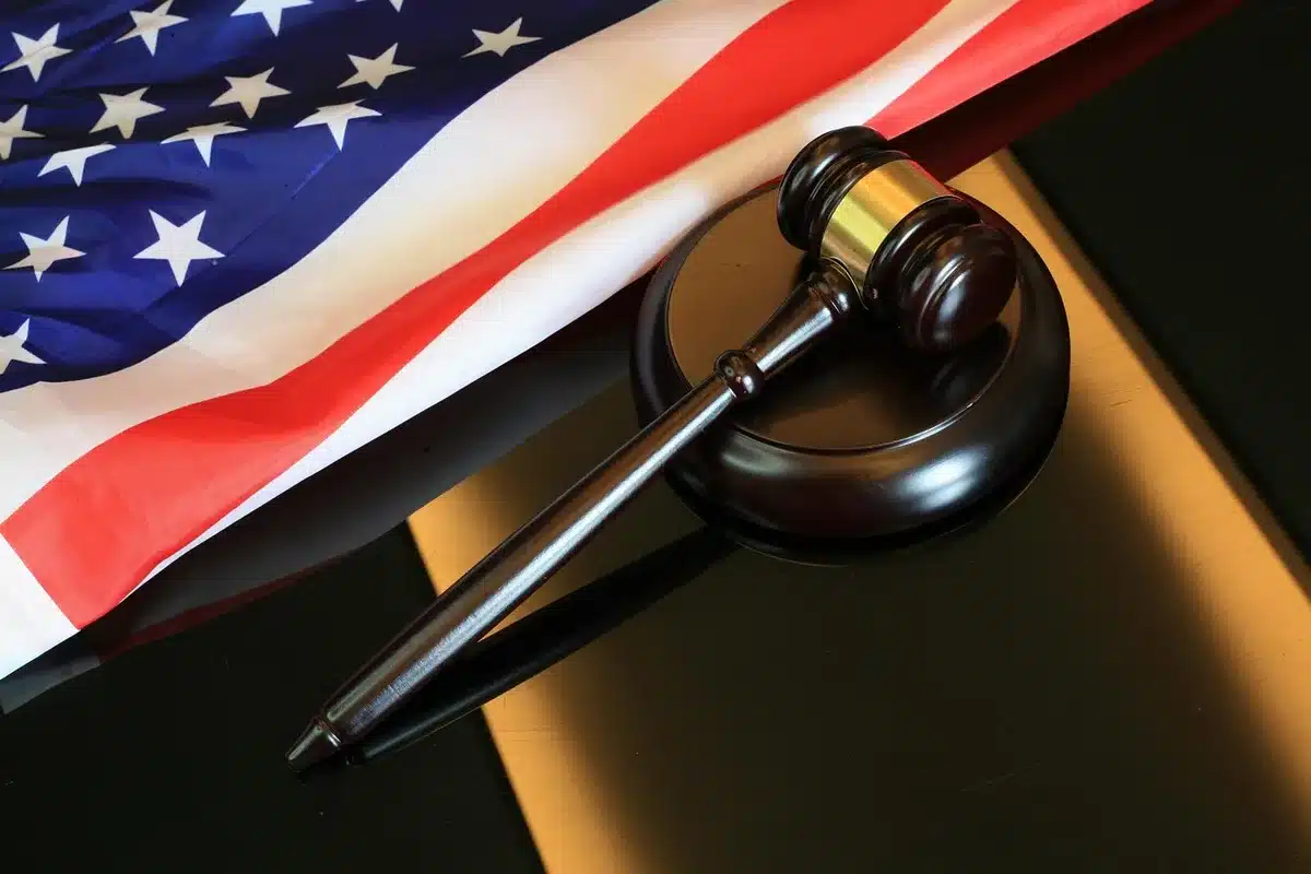Gavel and legal documents on a desk representing prosecution and legal questions