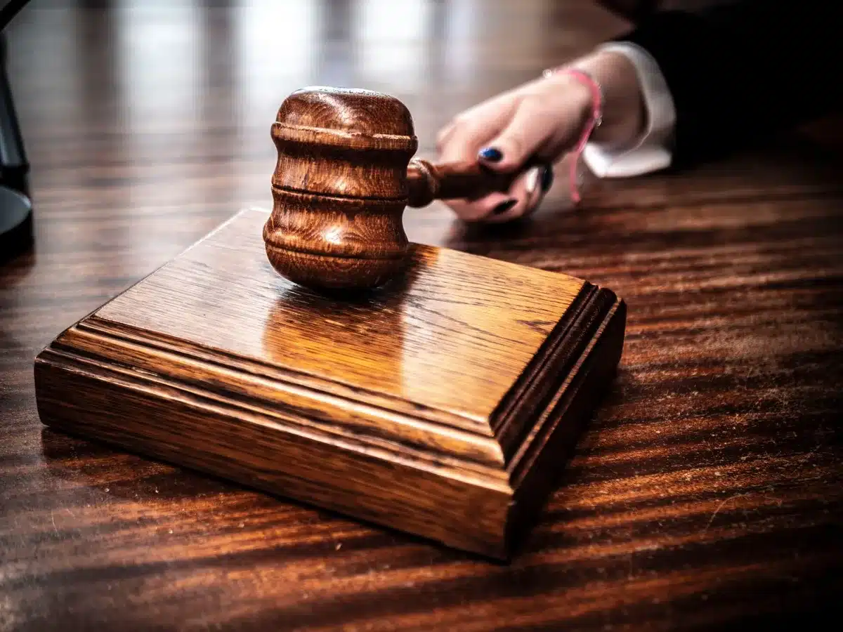 Court documents and gavel representing charges and court dates